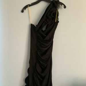 Woman’s black cocktail one shoulder dress